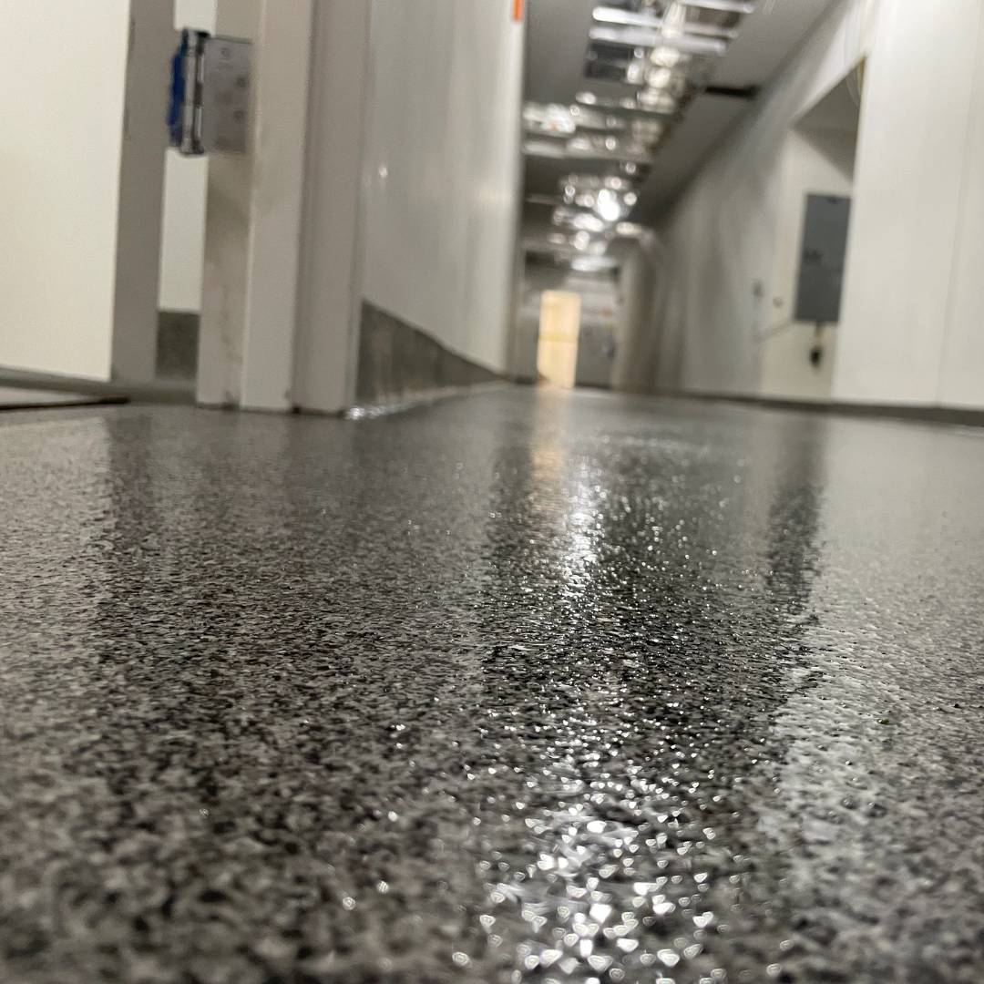 Close up shot of flake epoxy flooring in a commercial building