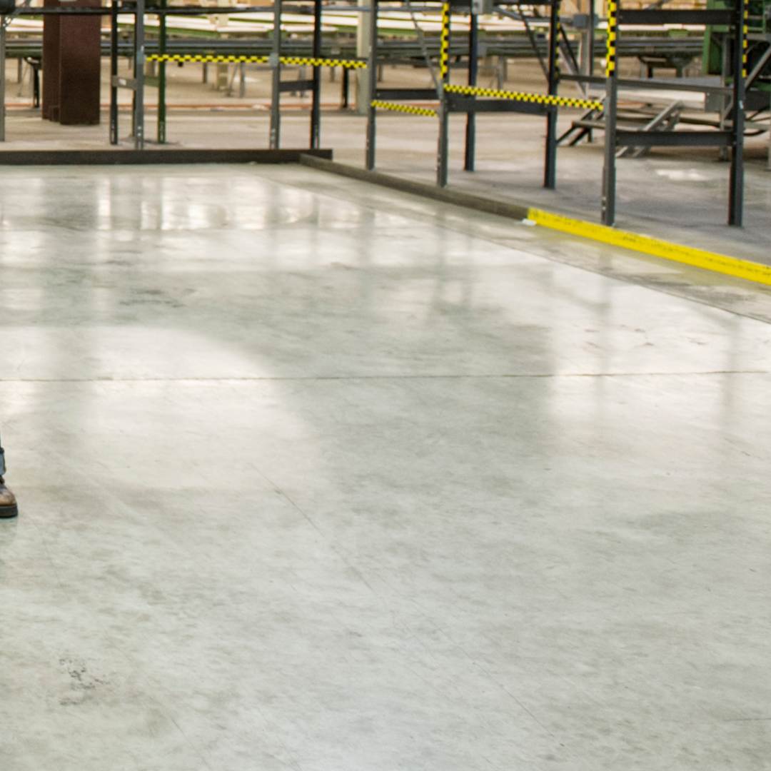 Polished Concrete Floors in industrial warehouse with conveyor belts