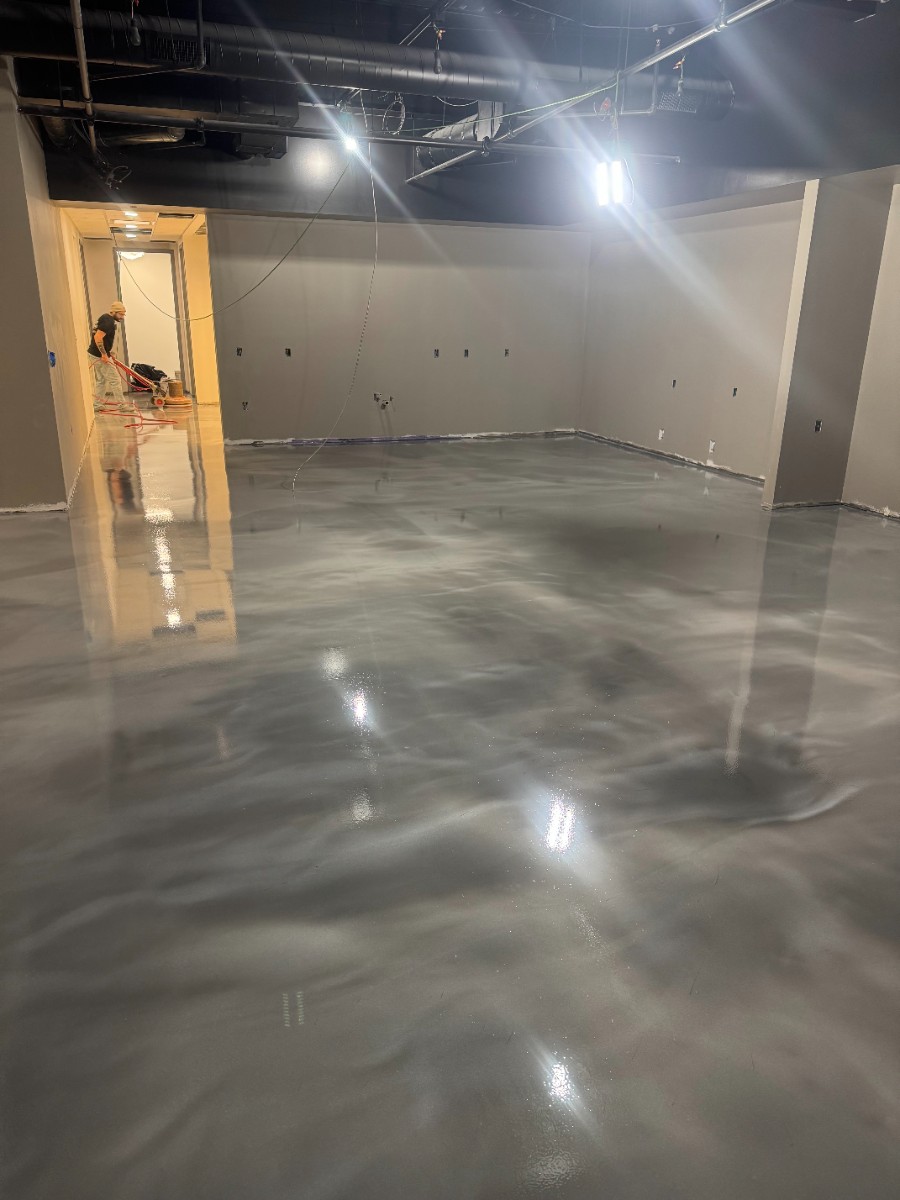 Sealtech crew installing epoxy flooring on a job site